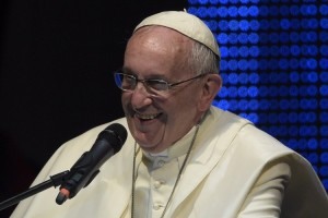 Pope Francis delivers a speech during a meeting with young people at the "Costanera" in Asuncion on July 12, 2015. Pope Francis visited a Paraguay slum on Sunday, the final day of his South America tour, in a show of support for one of the nation's poorest communities where residents are struggling for land rights.    AFP PHOTO / JUAN MABROMATA