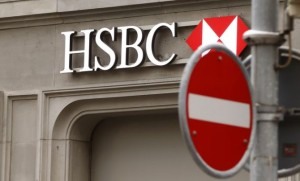 A traffic sign is seen in front of a branch office of HSBC bank at the Paradeplatz in Zurich